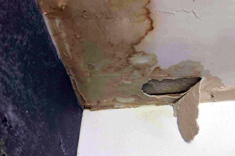 Leaking roof and ceiling damage requiring roof repair in Glasgow.